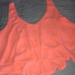 Bright pastel orange top